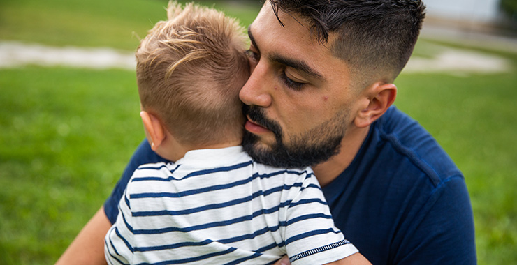 dad hugging young son