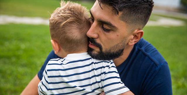 dad hugging young son