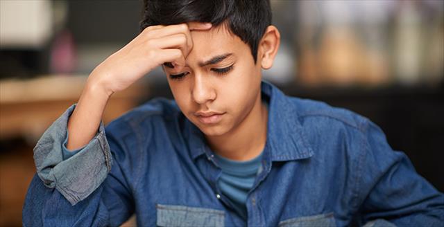 boy concentrating on school work