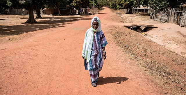 A Senegalese woman displaced by political unrest returns to her home