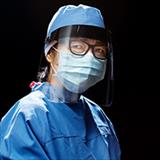 woman wearing personal protective equipment