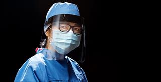 woman wearing personal protective equipment