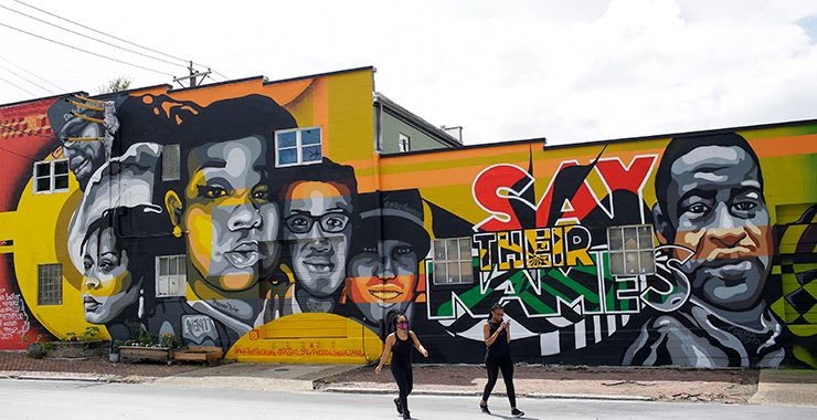 street scene with graffiti on wall in support of Black Lives Matter