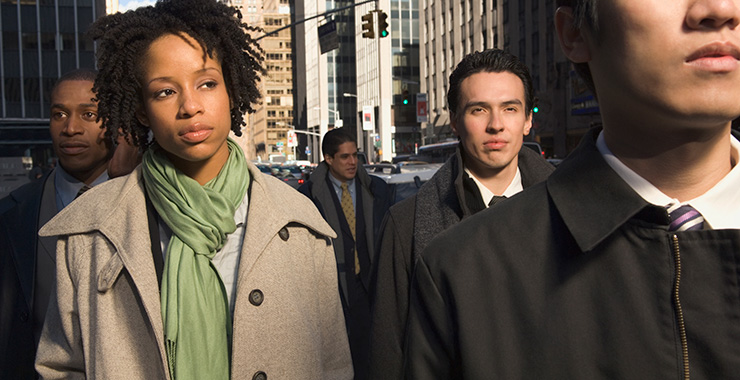 professional woman walking on a city street