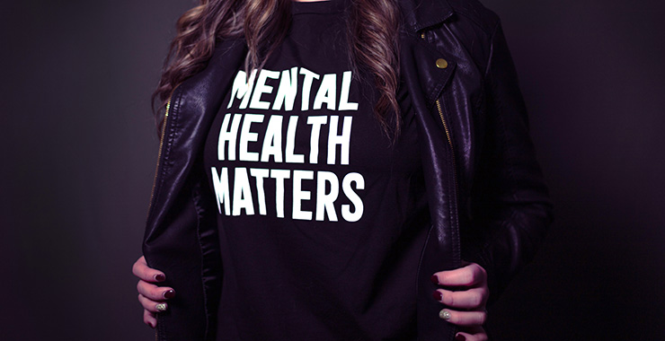 woman wearing a tshirt that says mental health matters