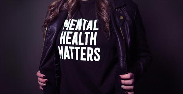 woman wearing a tshirt that says mental health matters