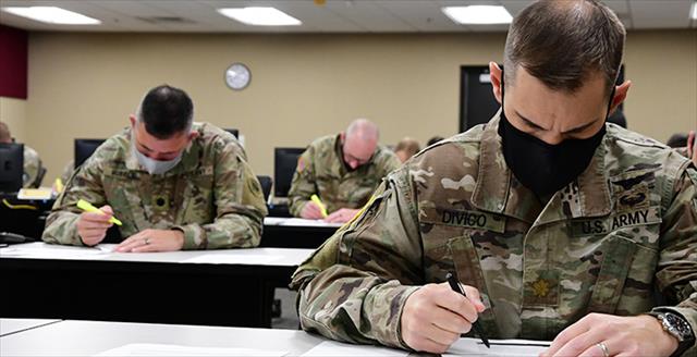 Army officers taking a written assessment