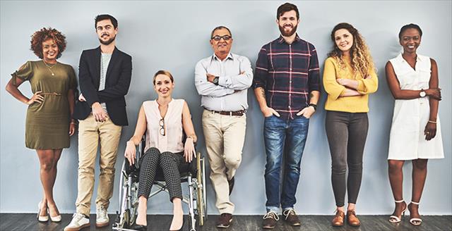 people of various backgrounds standing in a row