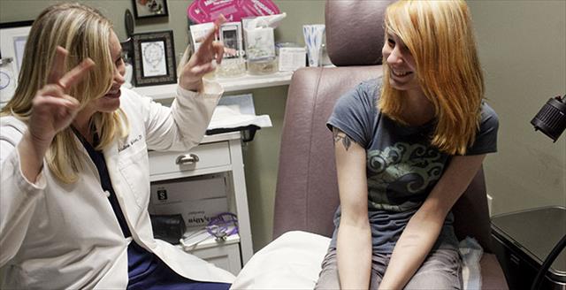 doctor with teen patient
