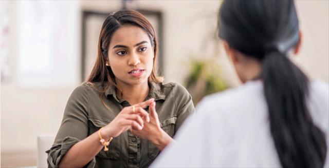 counselor having a conversation with an adult client