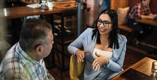 two adults having a discussion