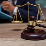 gavel and scales of justice on a desk