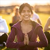 group of people participating in an outdoor yoga class