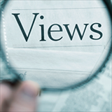 hand holding a magnifying glass