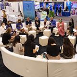 group of professionals sitting together sharing ideas