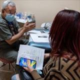 woman of color having a conversation with a medical professional