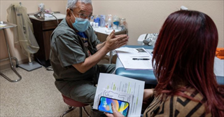 woman of color having a conversation with a medical professional