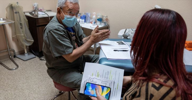 woman of color having a conversation with a medical professional