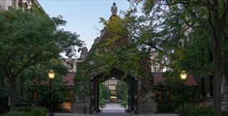 ivy-covered gate entrance to an academic building