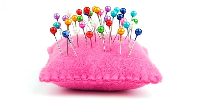 pin cushion with several straight pins