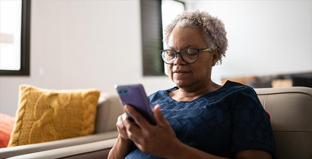 older woman looking at a smartphone