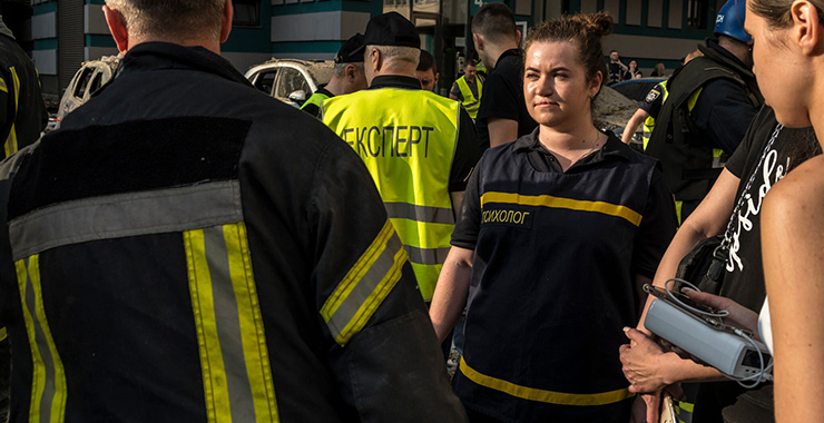 emergency personnel assisting people
