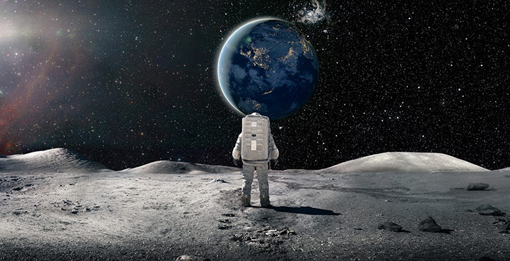 astronaut on the moon looking at Earth