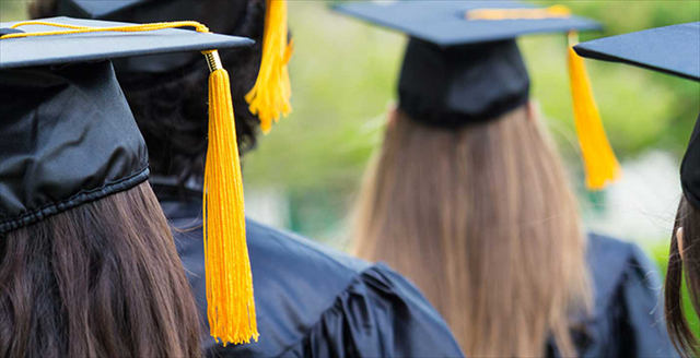 students wearing graduation caps