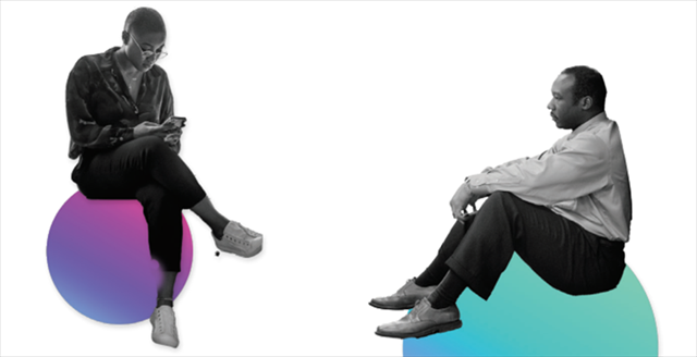 woman looking down at a smartphone and a man taking a break sitting down