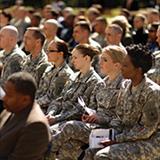 group of military people listening to a presentation
