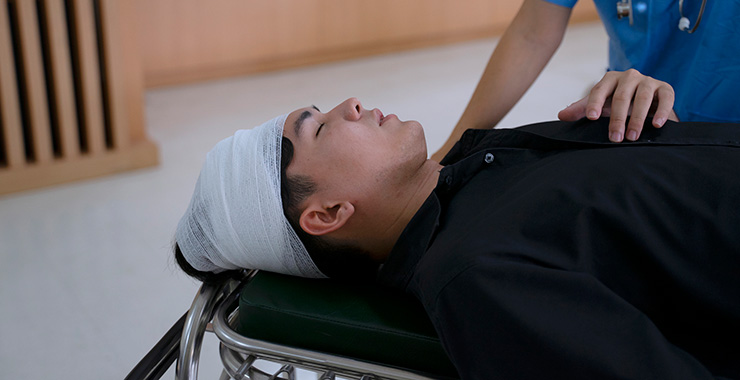 person with head bandaged 