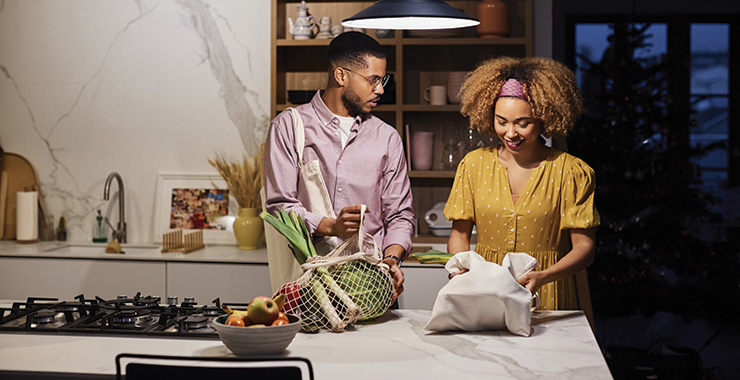 couple unloading groceries