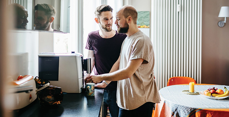 male couple enjoying coffee together