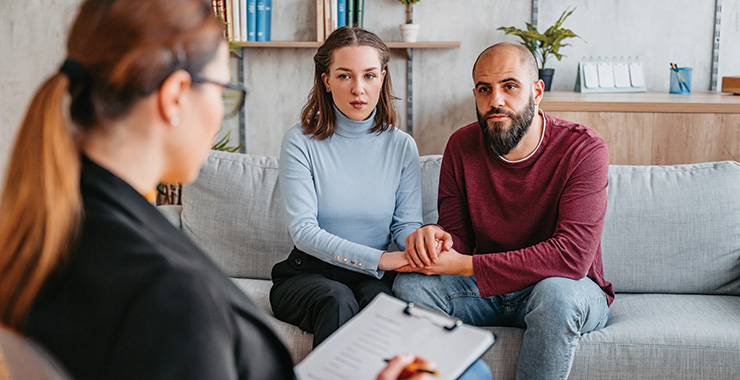 couple speaking with a professional