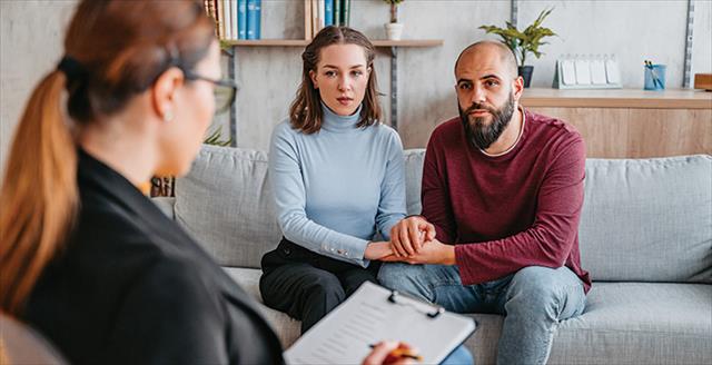 couple speaking with a professional