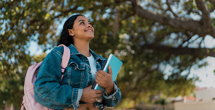 girl holding school books