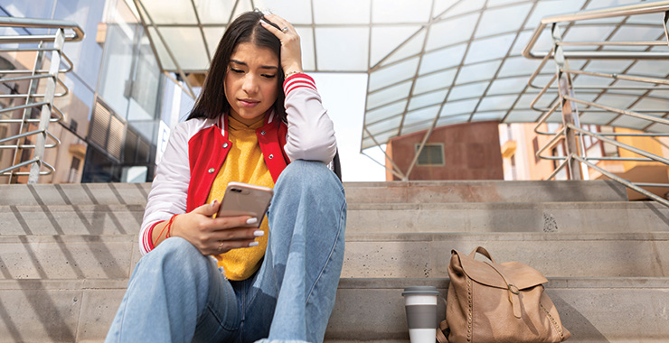 young woman looking at a smartphone
