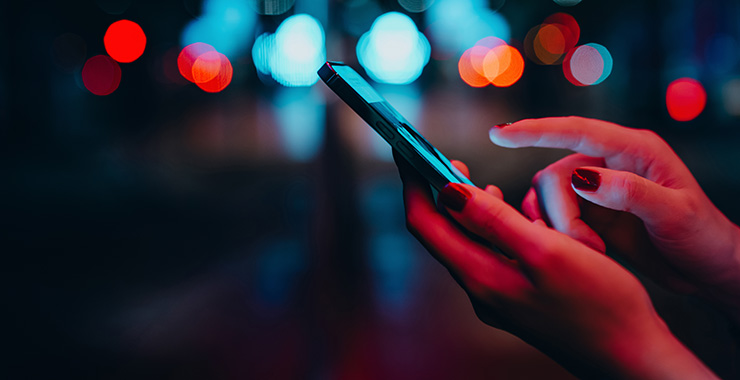 closeup of hands holding a smartphone