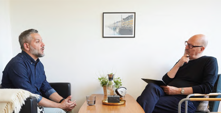 man having a conversation with a professional
