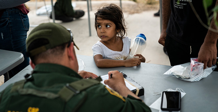 young girl refugee at processing center