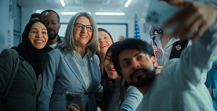 diverse group of people taking a selfie