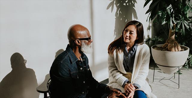 man and woman having a conversation