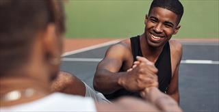two Black men shaking hands