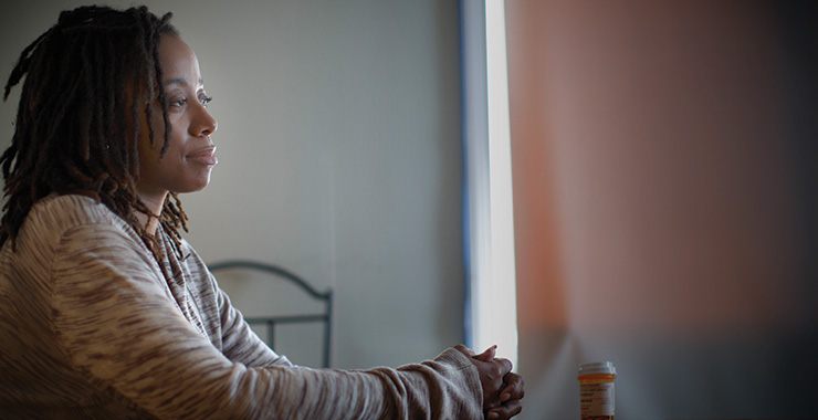 Black woman looking contemplative