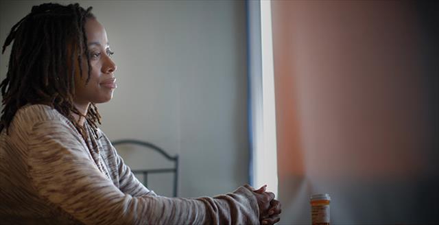 Black woman looking contemplative