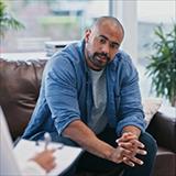 man speaking with a counselor
