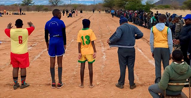 school boys in Botswana lining up for a race