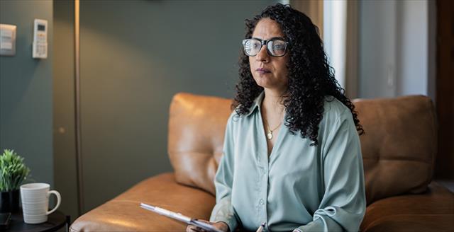 woman holding a clipboard and pen