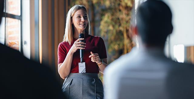 woman speaking using a microphone