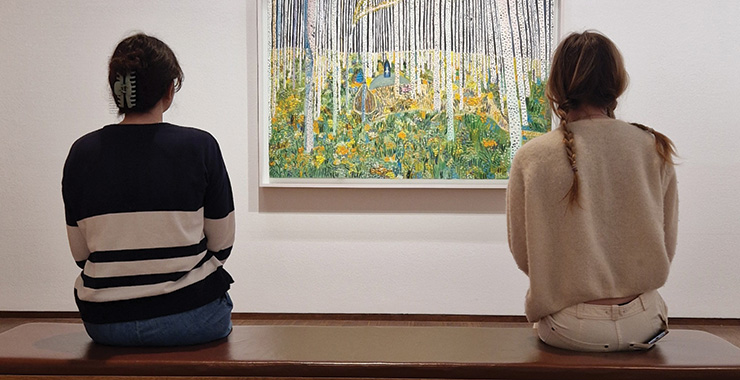 people looking at art